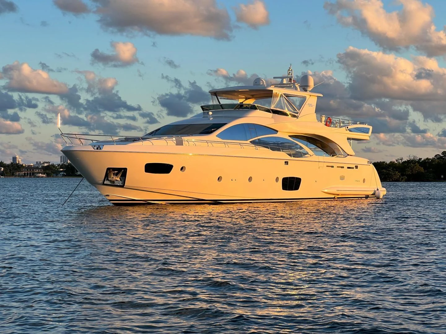 a yellow boat on the water aboard BT2 Yacht for Sale