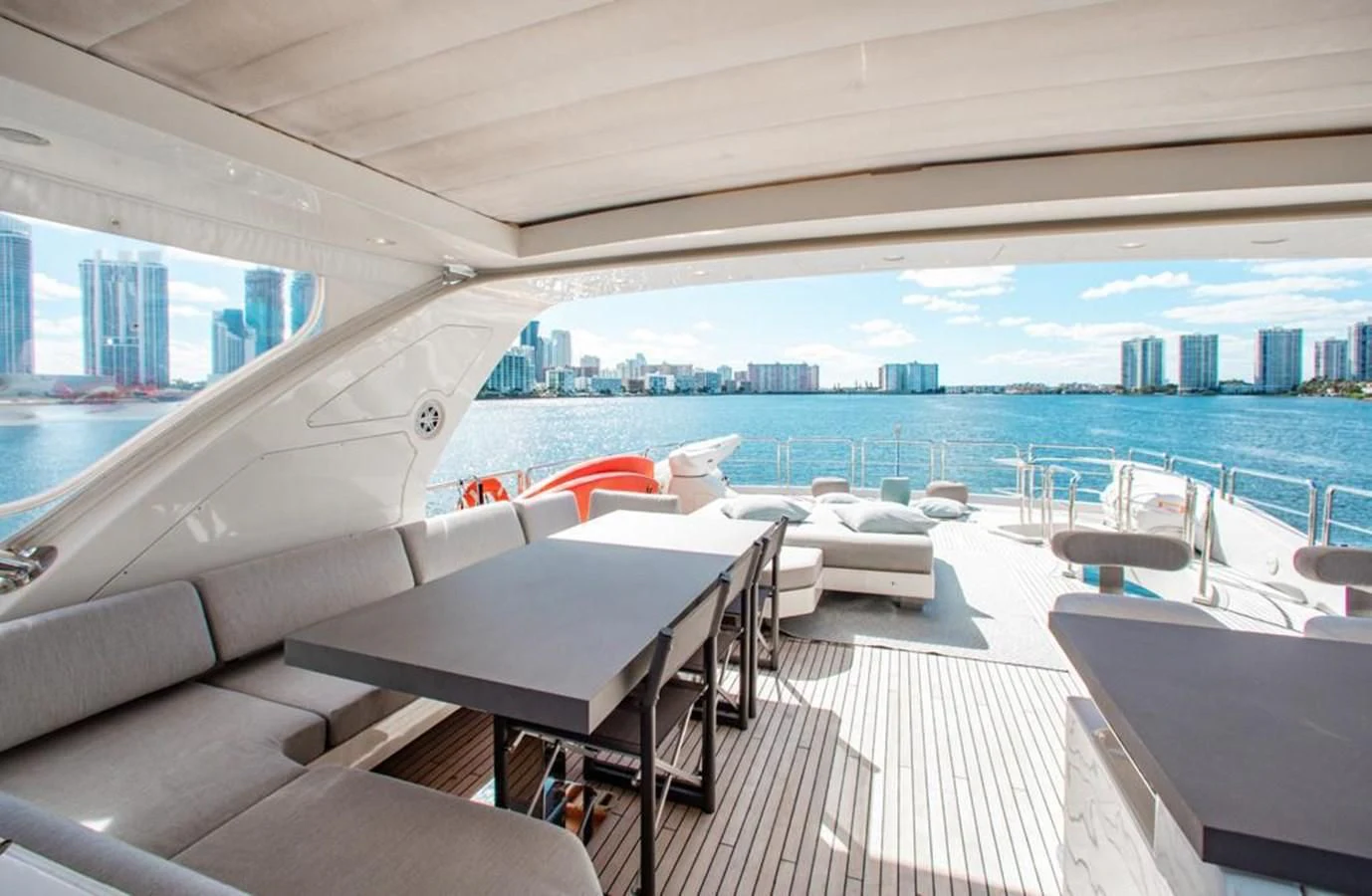 a room with a view of a city and a body of water aboard BT2 Yacht for Sale