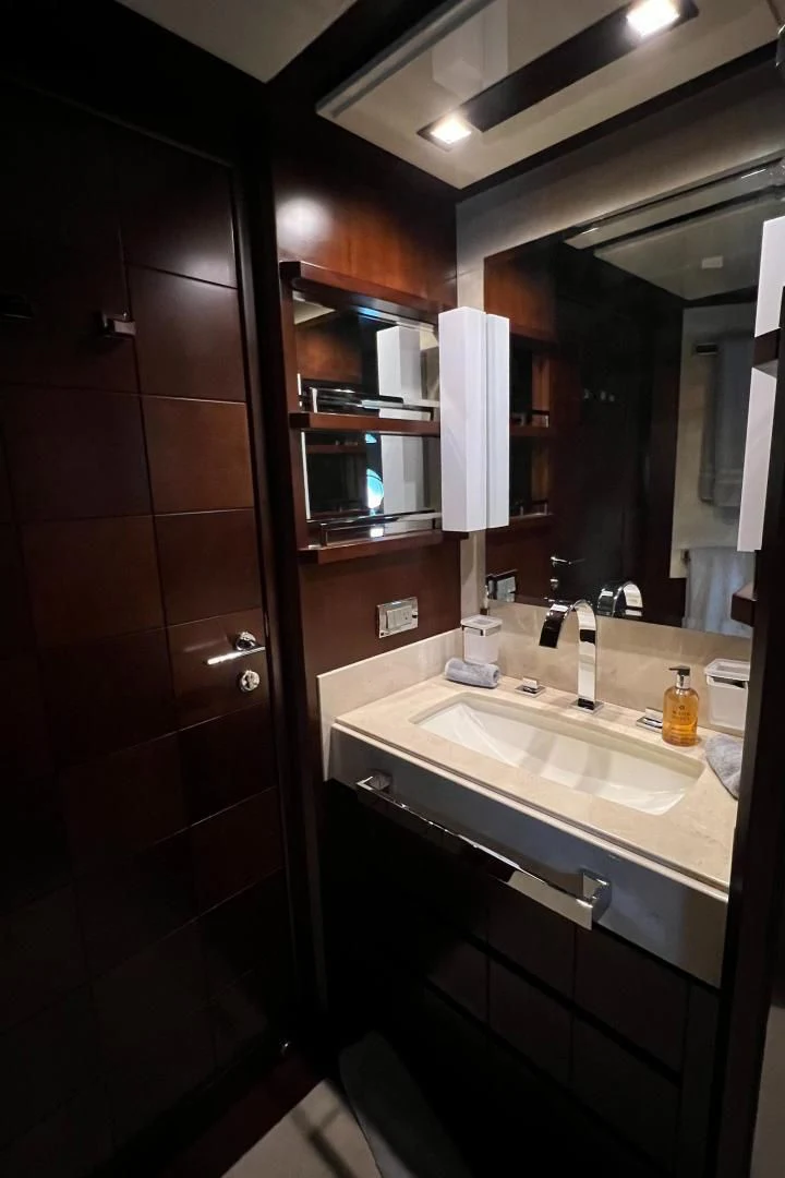 a bathroom with a sink and a mirror aboard BT2 Yacht for Sale