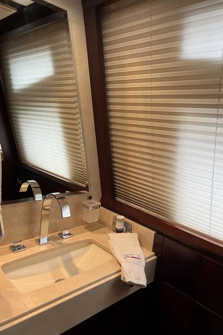 a bathroom with a sink and a window aboard BT2 Yacht for Sale