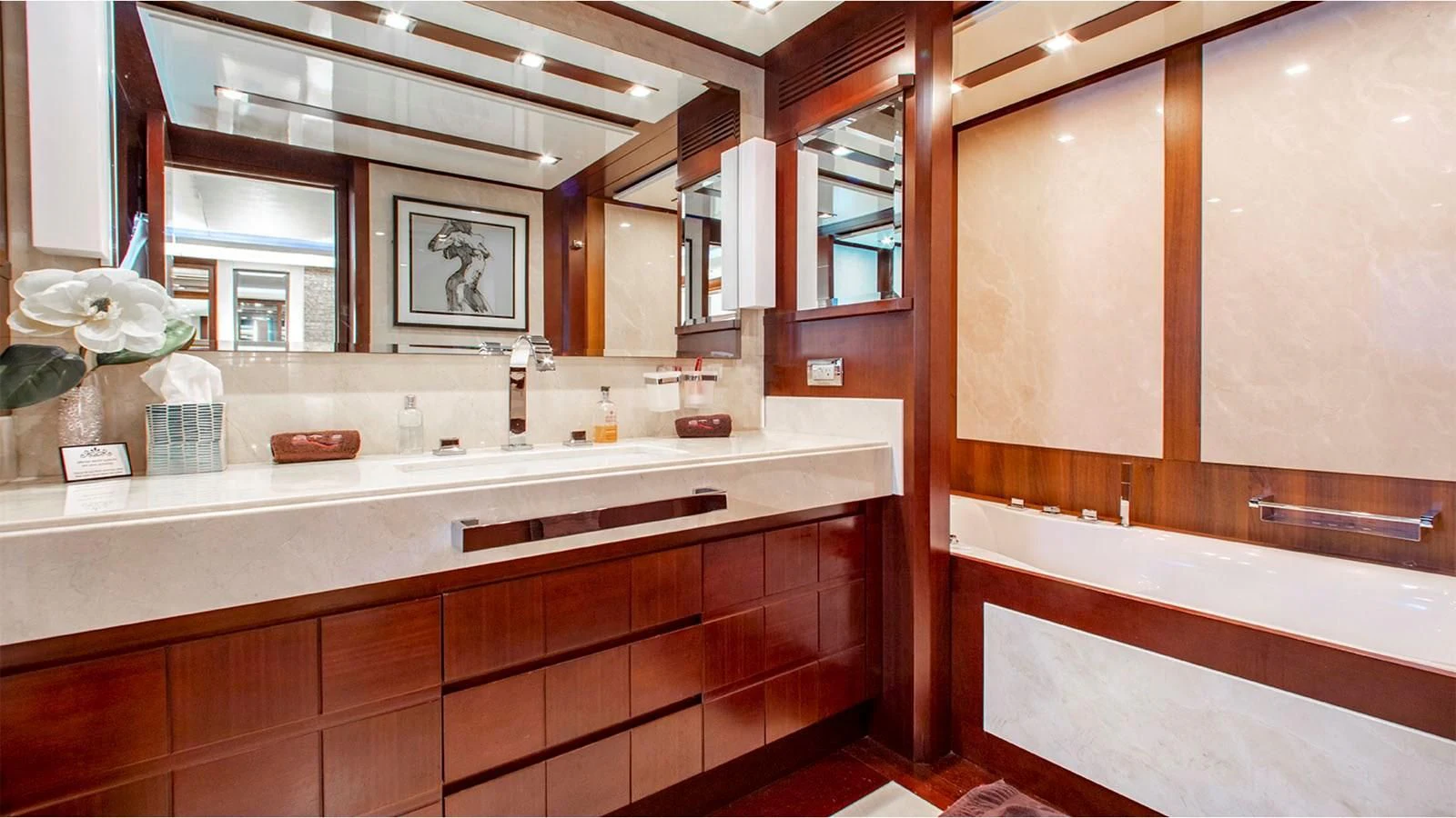 a bathroom with a countertop sink and cabinets aboard BT2 Yacht for Sale