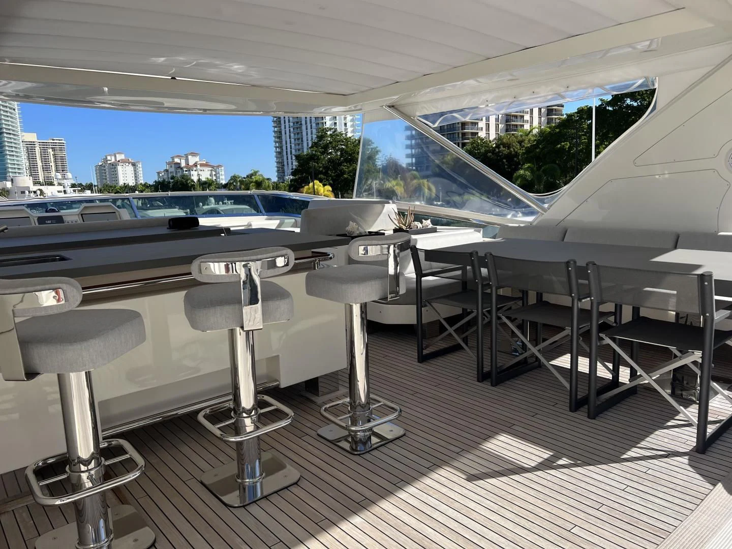 a room with tables and chairs aboard BT2 Yacht for Sale