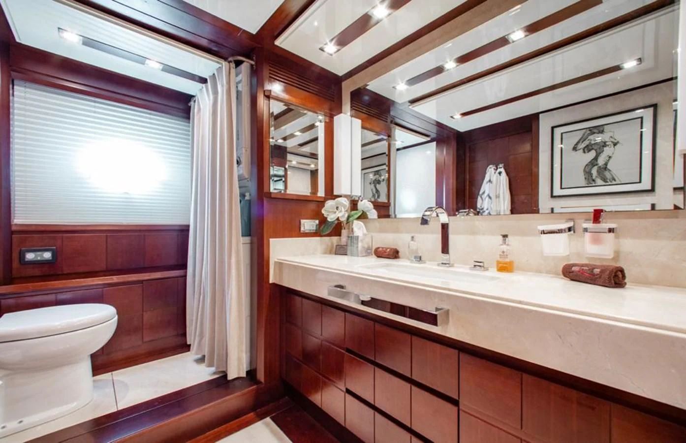 a bathroom with a large mirror aboard BT2 Yacht for Sale