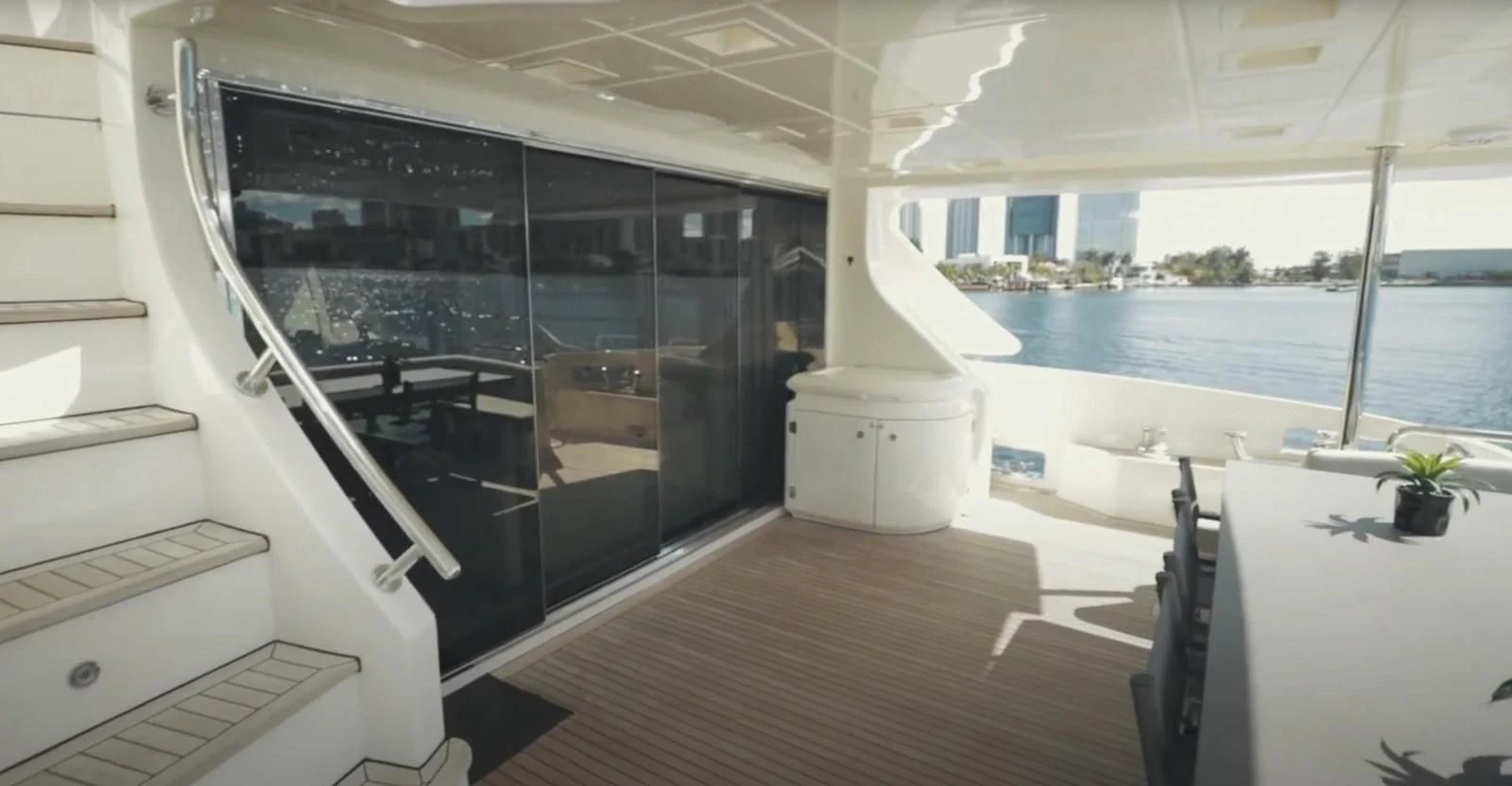 inside of a building with a large glass door and a balcony aboard BT2 Yacht for Sale