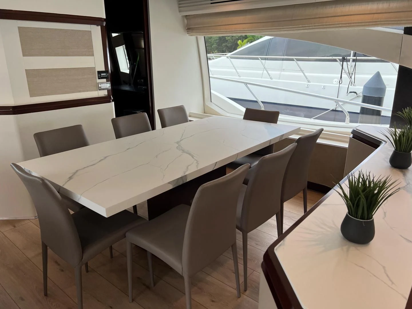 a table with chairs around it aboard BT2 Yacht for Sale
