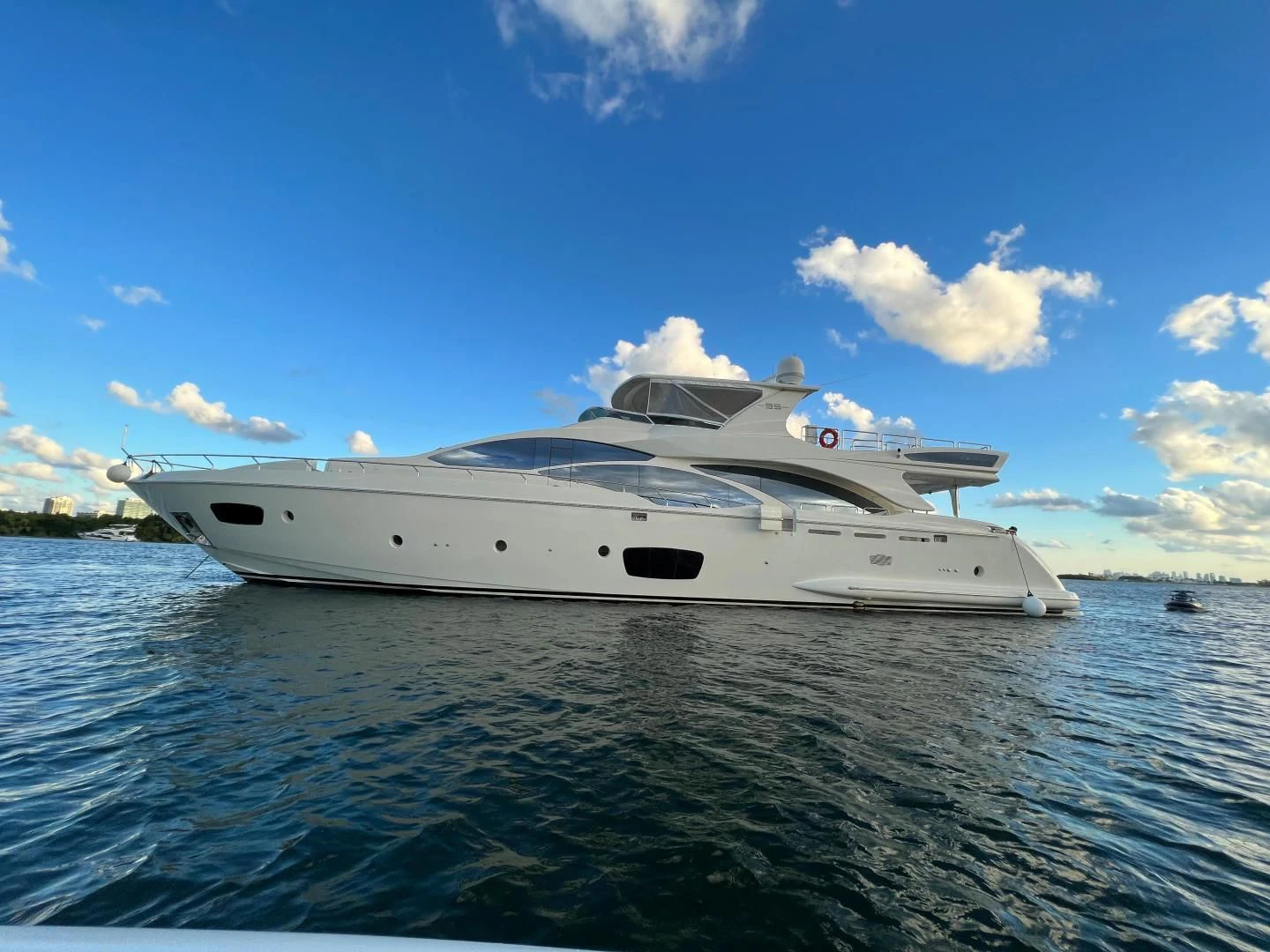 a white yacht on the water aboard BT2 Yacht for Sale