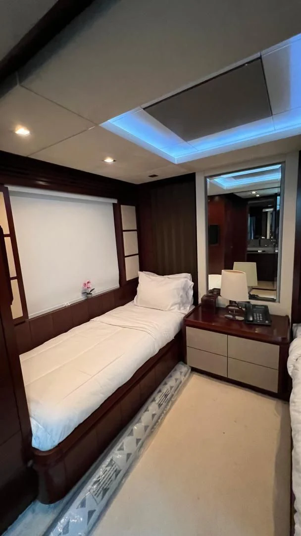 a bed with a blue canopy aboard BT2 Yacht for Sale