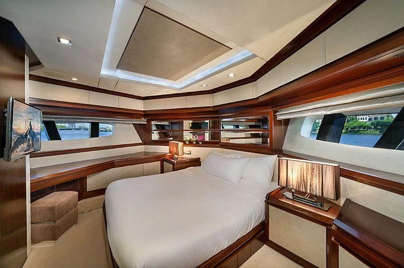 a room with a bed and a desk aboard BT2 Yacht for Sale