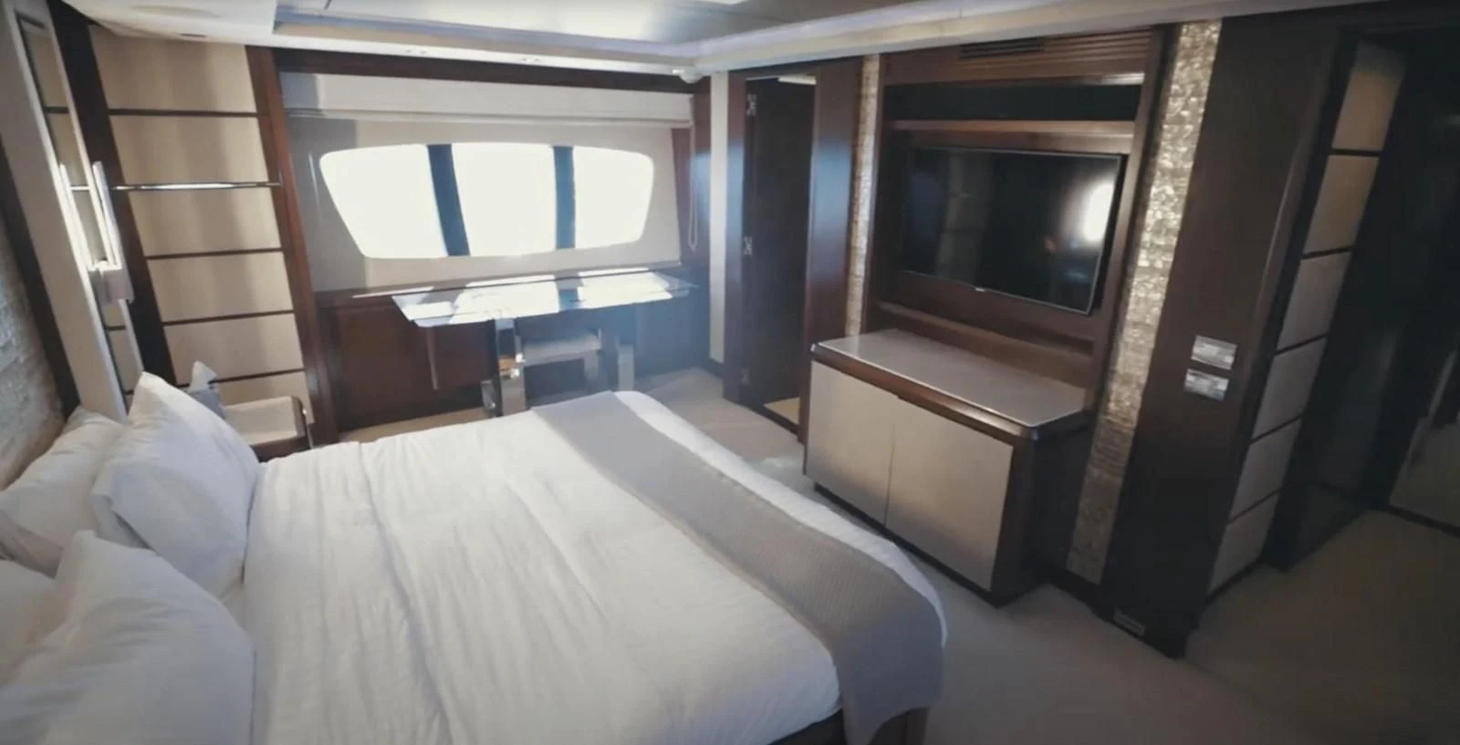 a room with a bed and a tv aboard BT2 Yacht for Sale