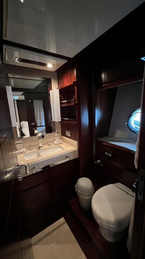 a bathroom with a toilet and sink aboard BT2 Yacht for Sale