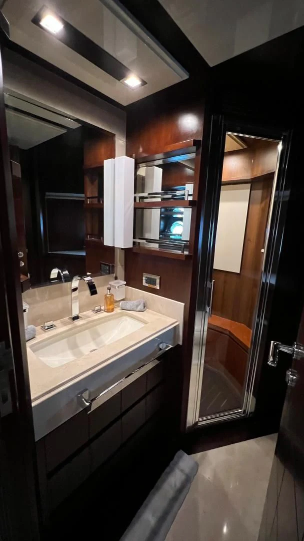 a bathroom with a sink and a mirror aboard BT2 Yacht for Sale