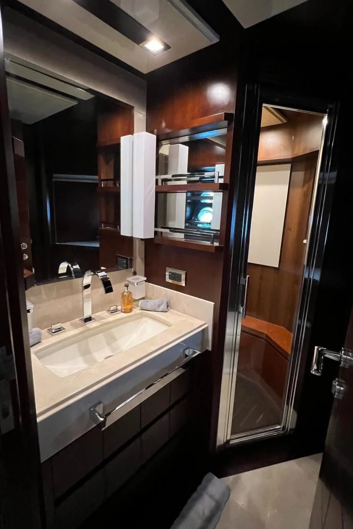 a bathroom with a sink and a mirror aboard BT2 Yacht for Sale