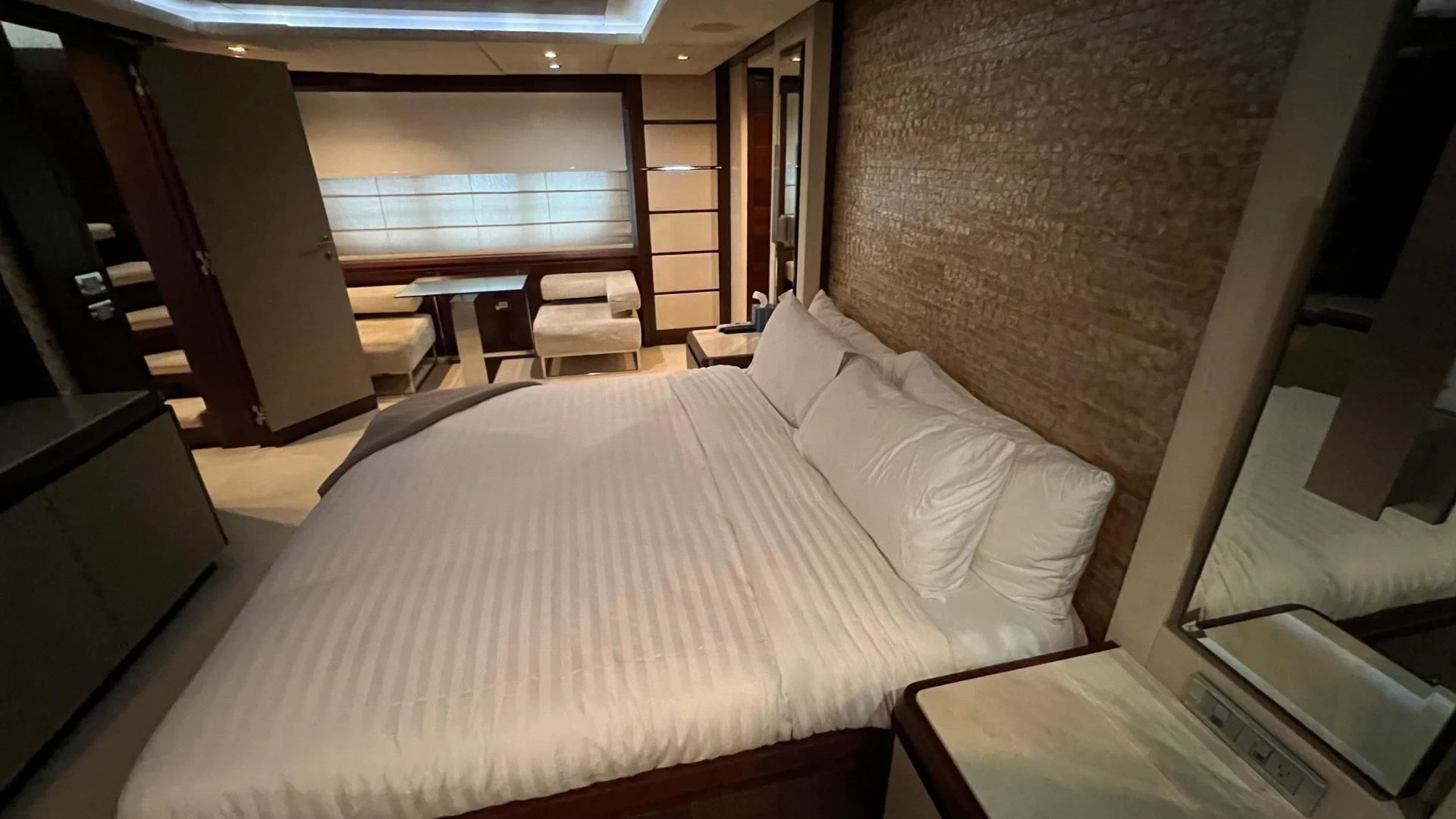 a room with a bed and a chair aboard BT2 Yacht for Sale