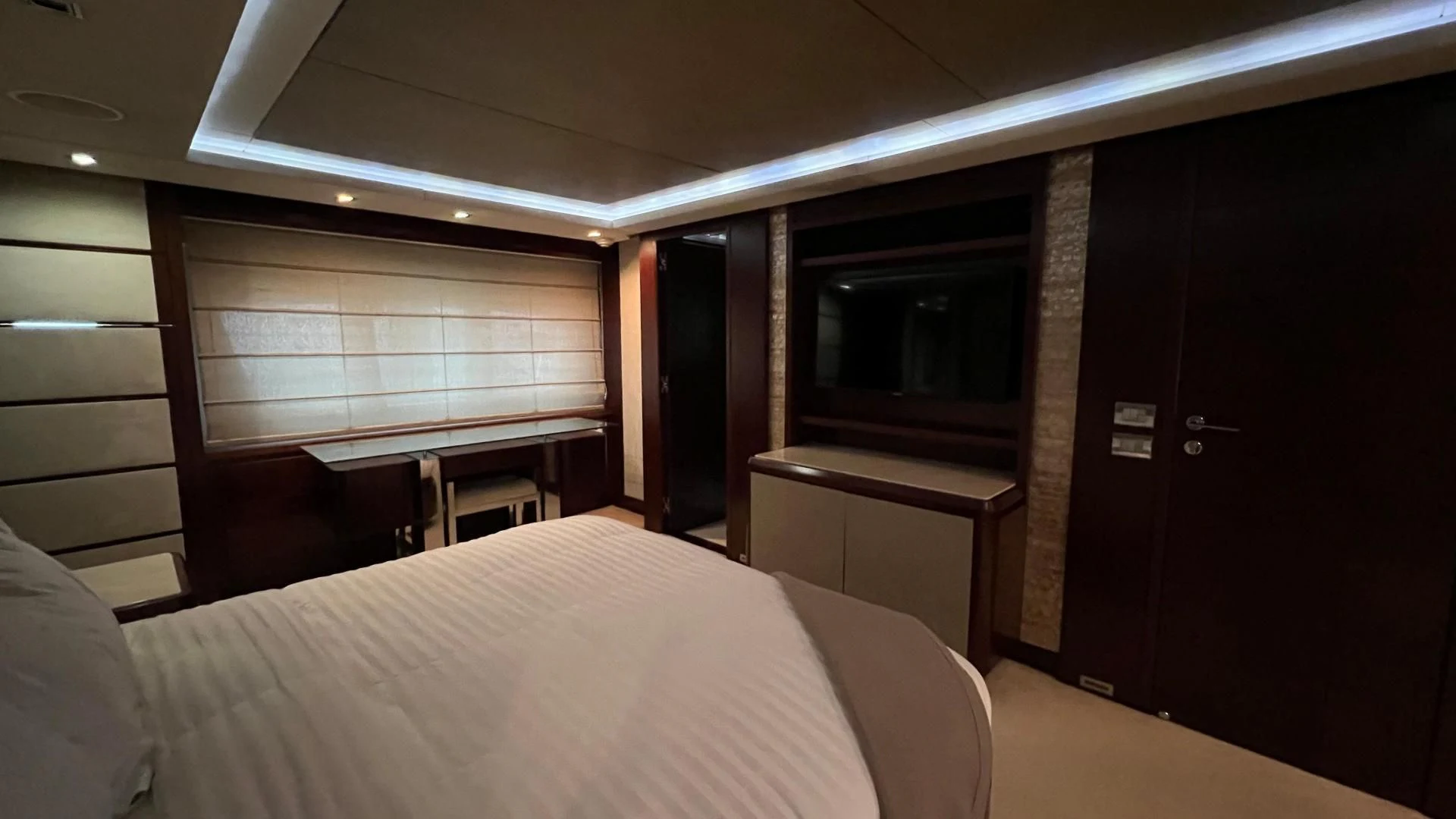 a room with a bed and a television aboard BT2 Yacht for Sale