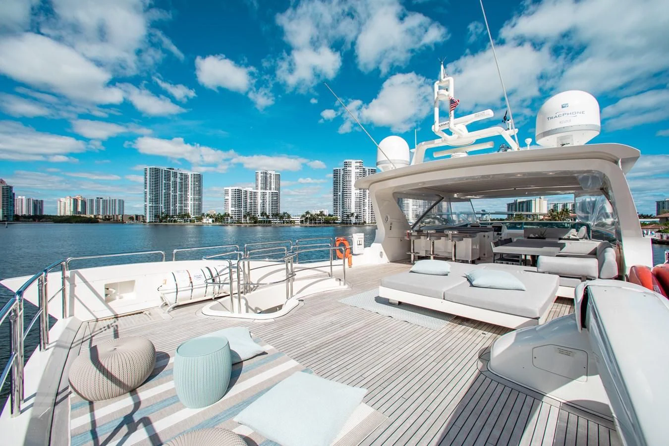 a deck with a view of a city and a body of water aboard BT2 Yacht for Sale