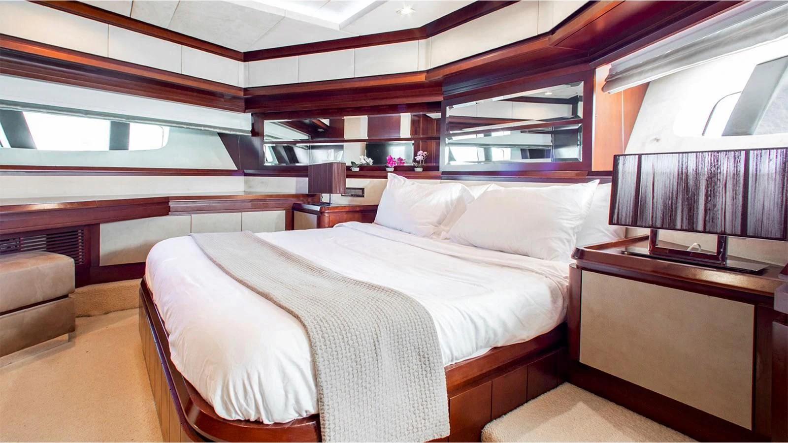 a room with a bed and a chair aboard BT2 Yacht for Sale