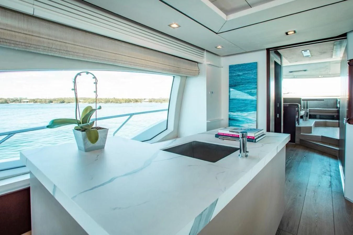 a white table with a plant on it aboard BT2 Yacht for Sale