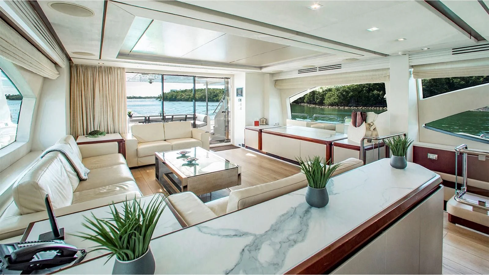 a living room with a large window aboard BT2 Yacht for Sale
