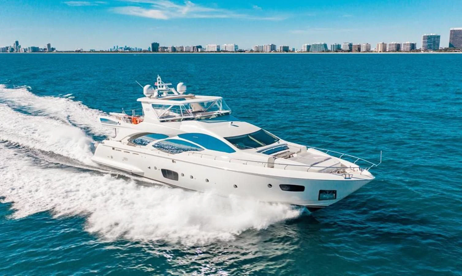 a white yacht on the water aboard BT2 Yacht for Sale
