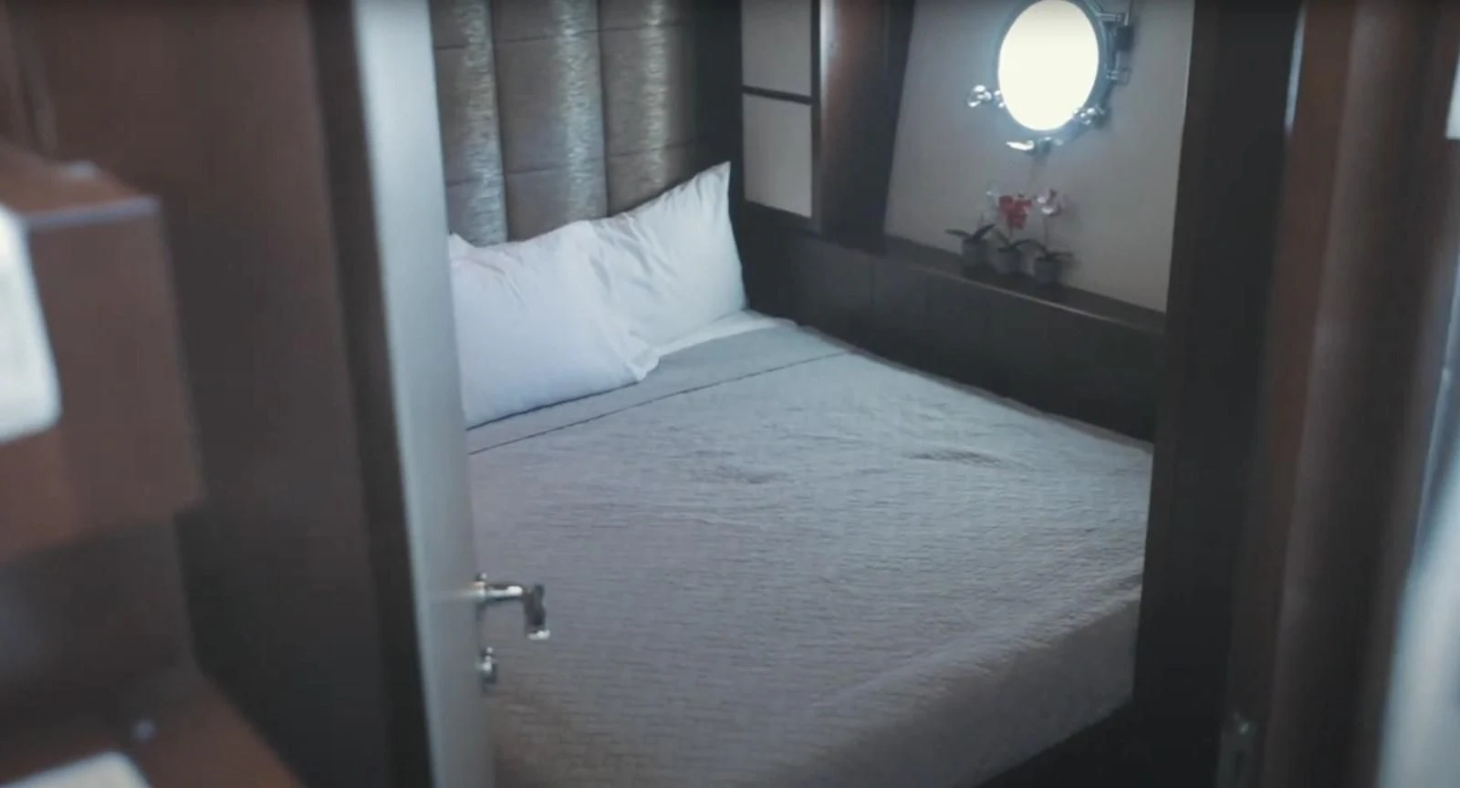 a bed with white sheets aboard BT2 Yacht for Sale