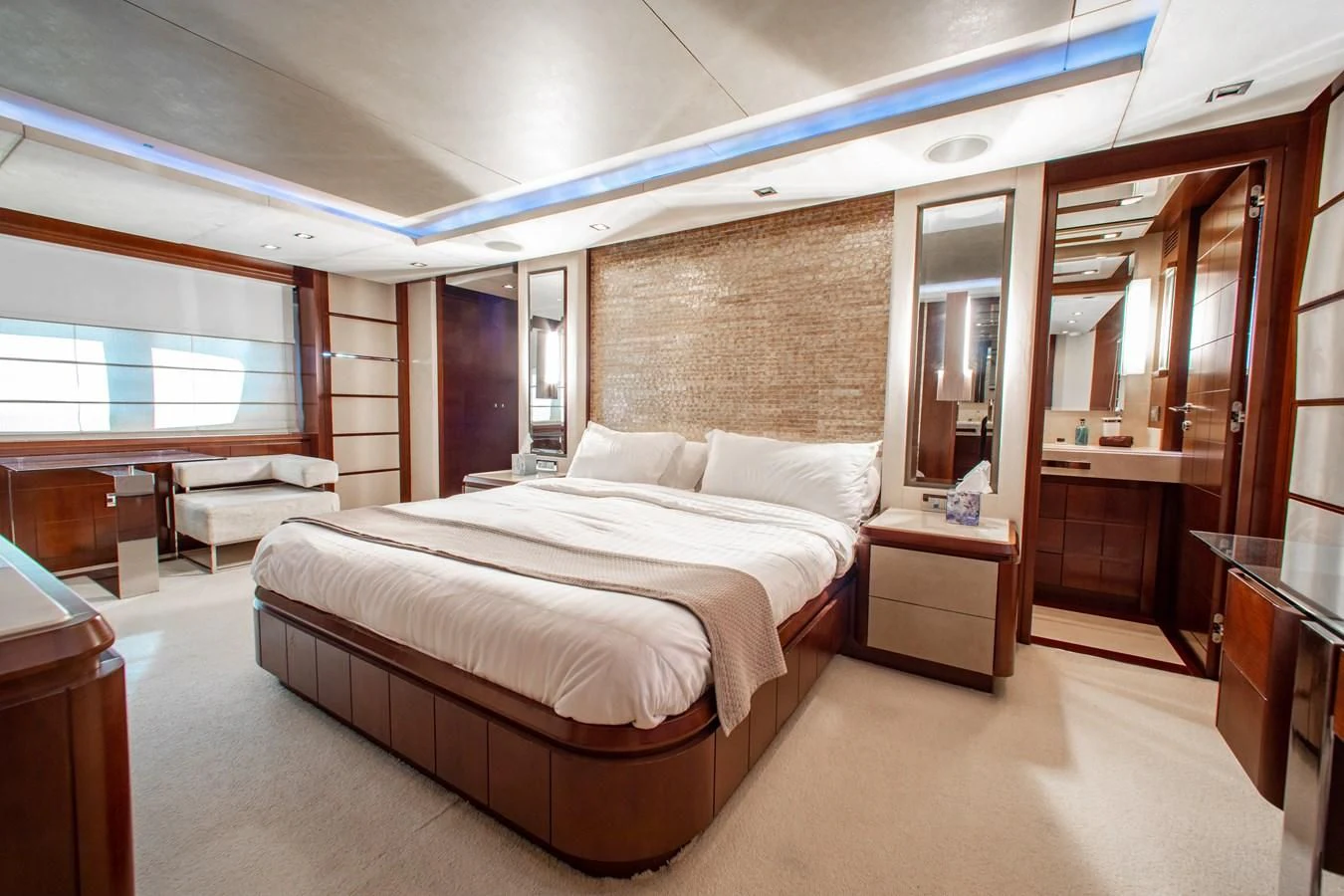 a large bedroom with a large bed aboard BT2 Yacht for Sale