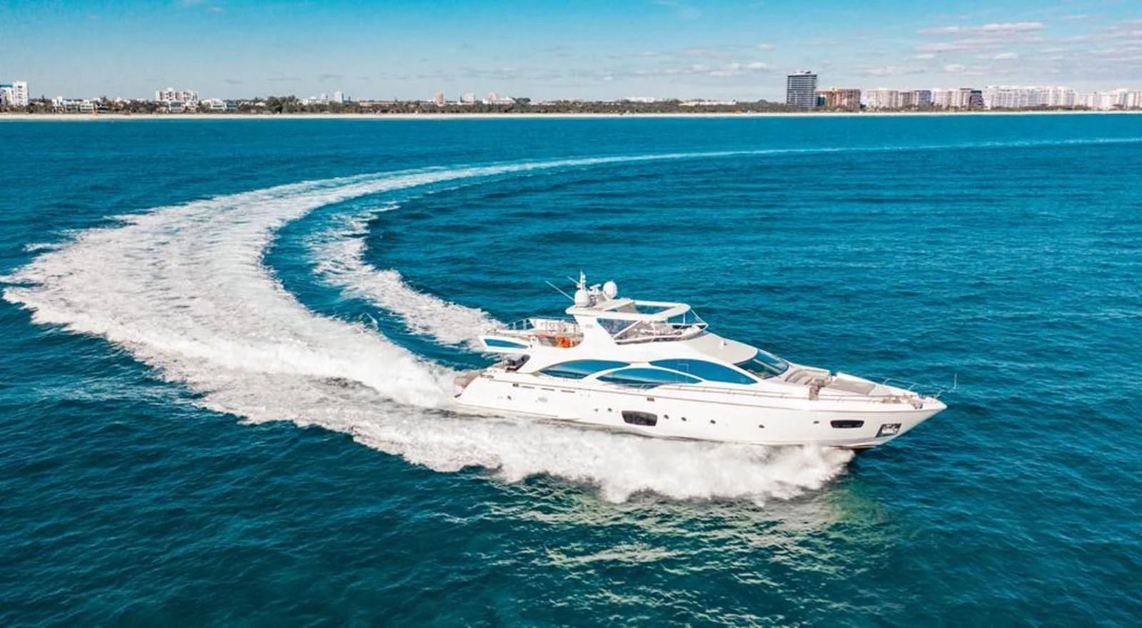 a white yacht on the water aboard BT2 Yacht for Sale