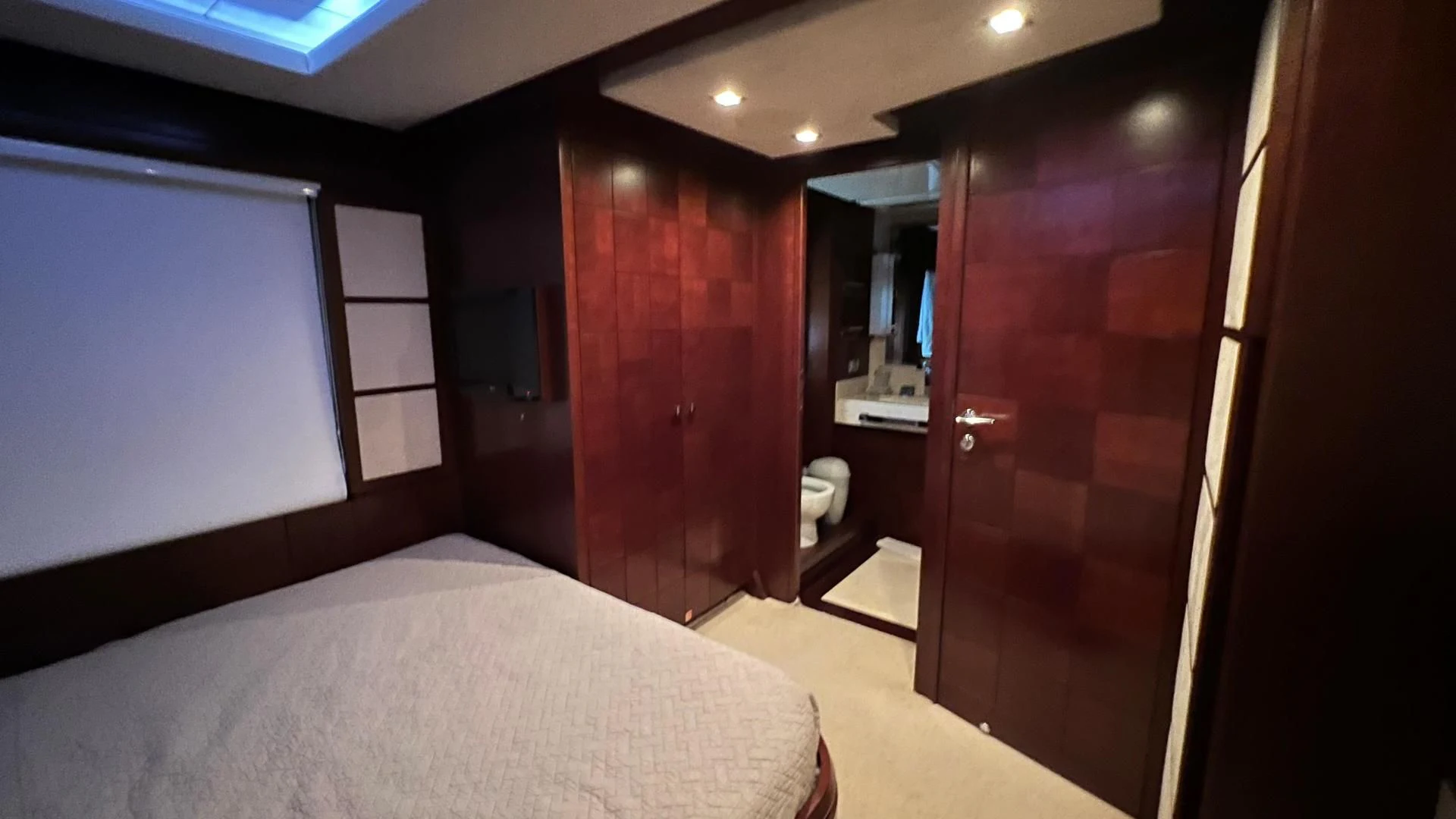 a room with a bed and a closet aboard BT2 Yacht for Sale