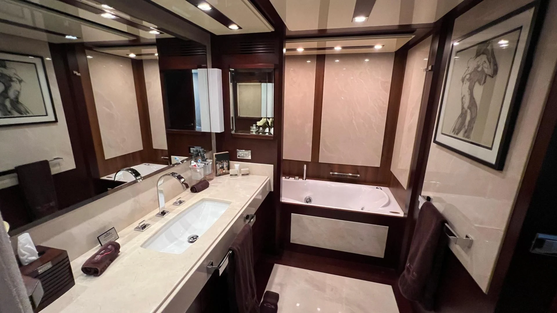 a bathroom with a large mirror aboard BT2 Yacht for Sale