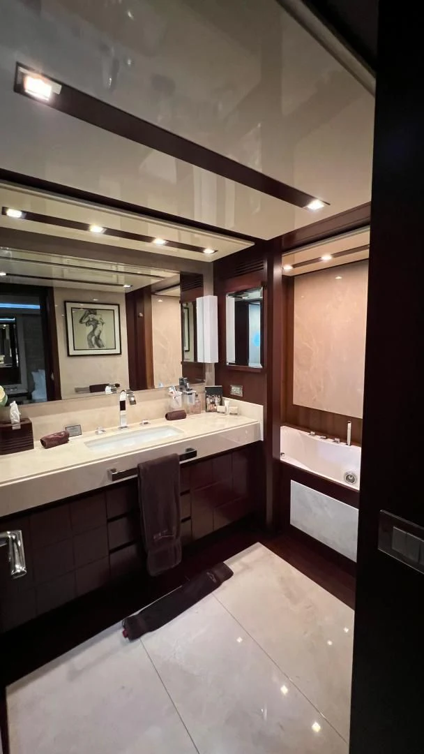 a bathroom with a large mirror aboard BT2 Yacht for Sale