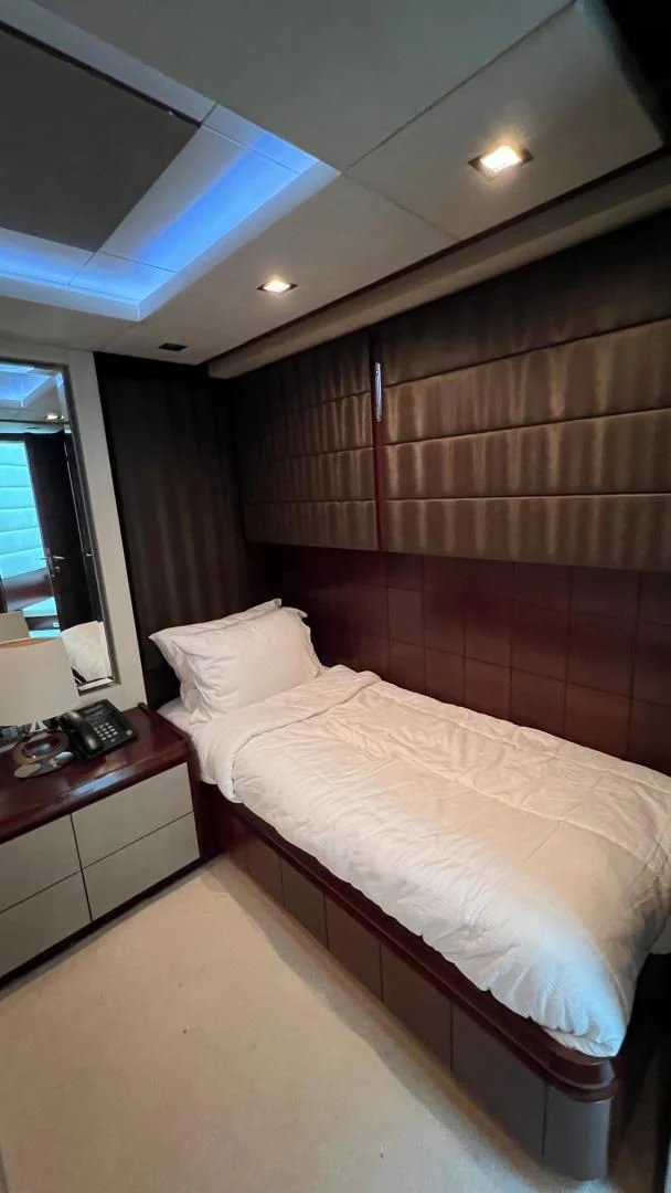 a bed with a white sheet aboard BT2 Yacht for Sale
