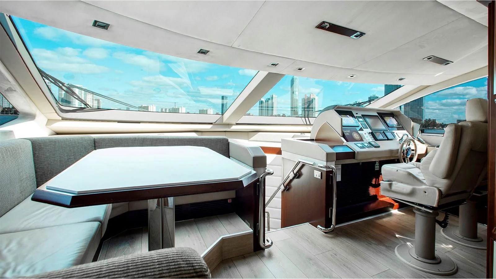 a room with a table and chairs aboard BT2 Yacht for Sale