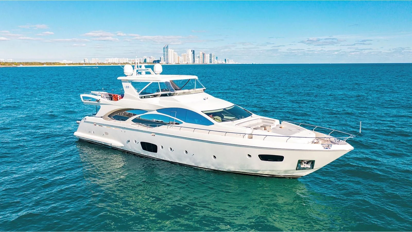 a white yacht in the water aboard BT2 Yacht for Sale