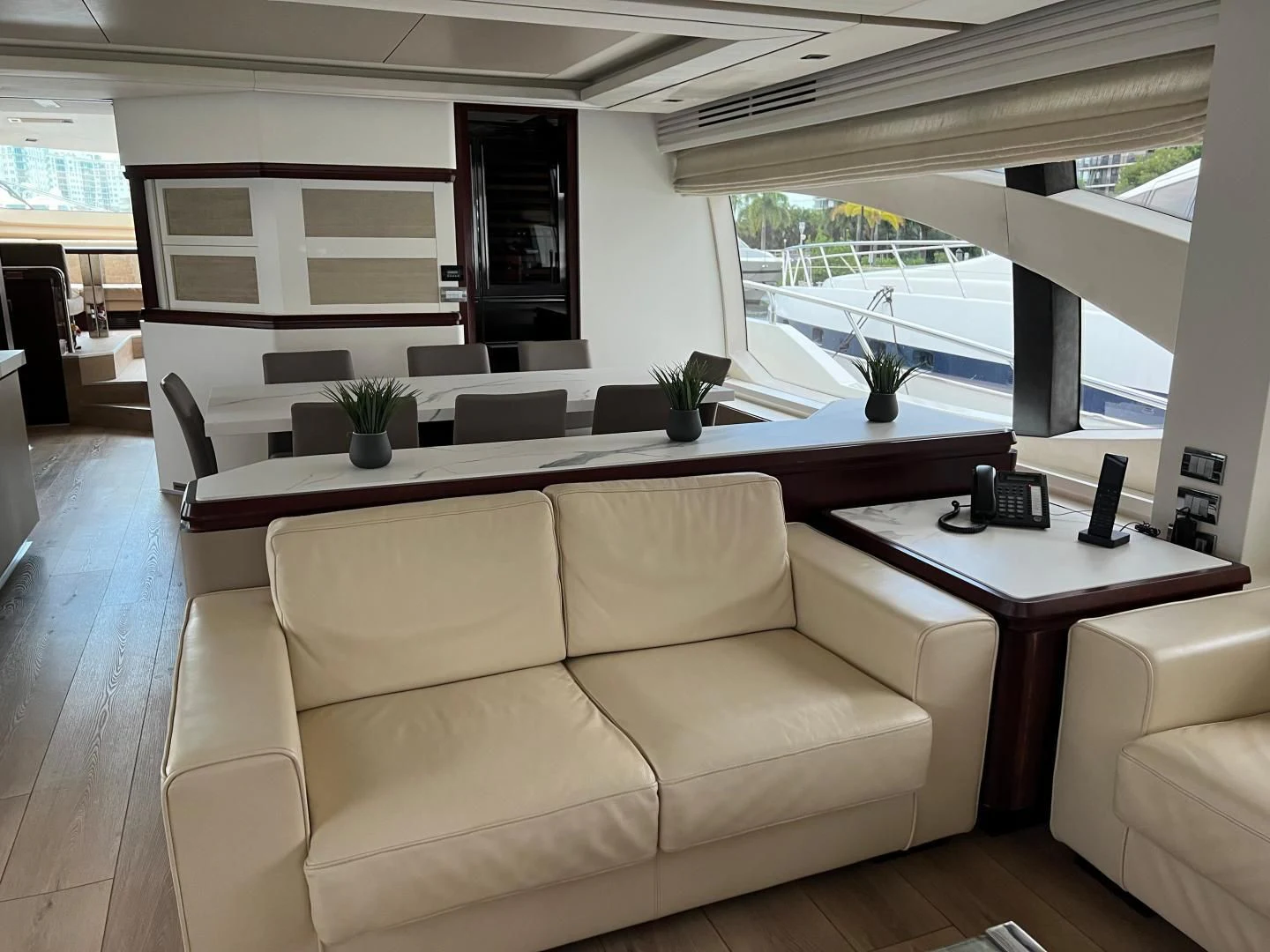 a living room with a couch and a table aboard BT2 Yacht for Sale
