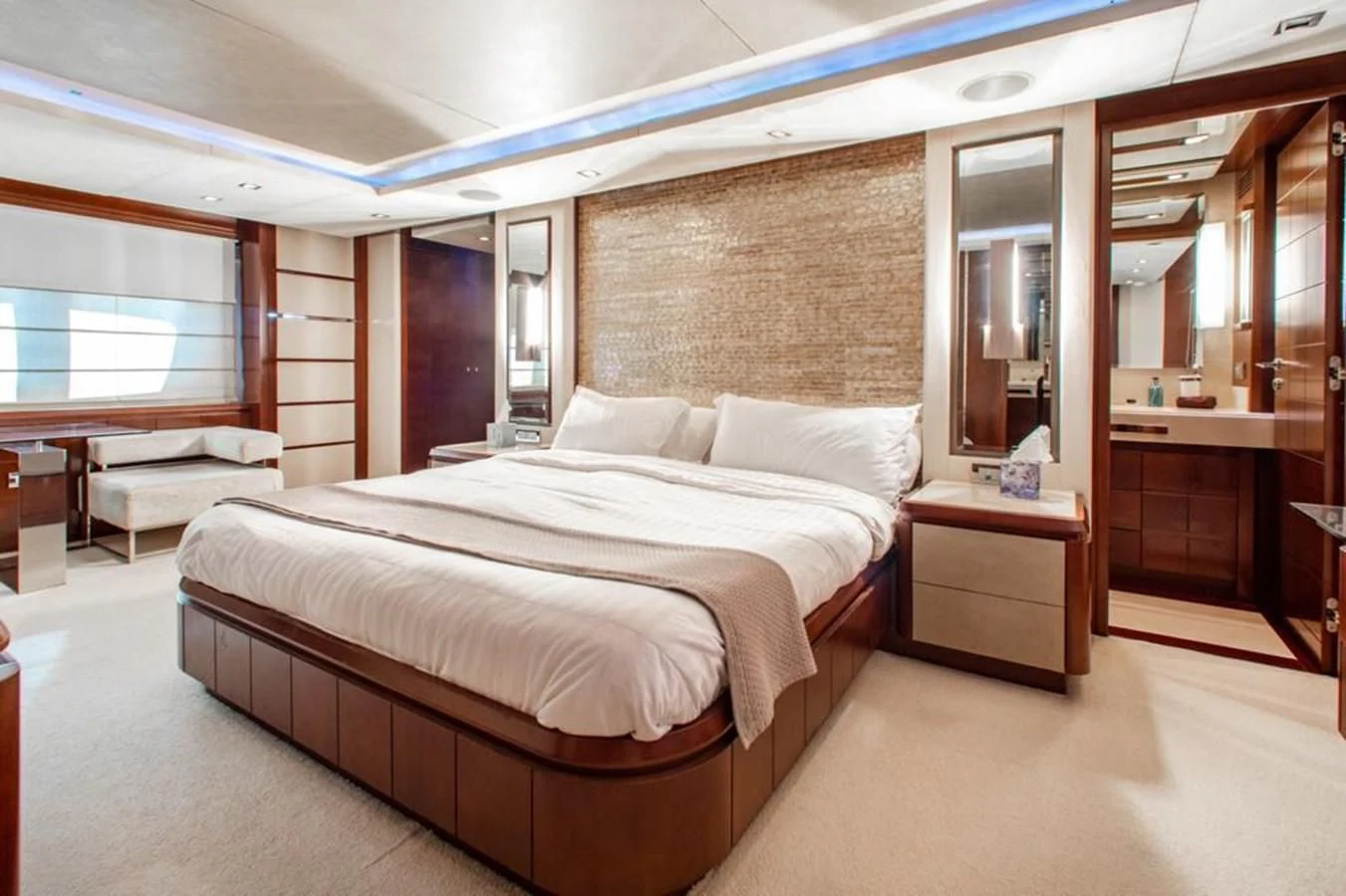 a room with a bed and a mirror aboard BT2 Yacht for Sale