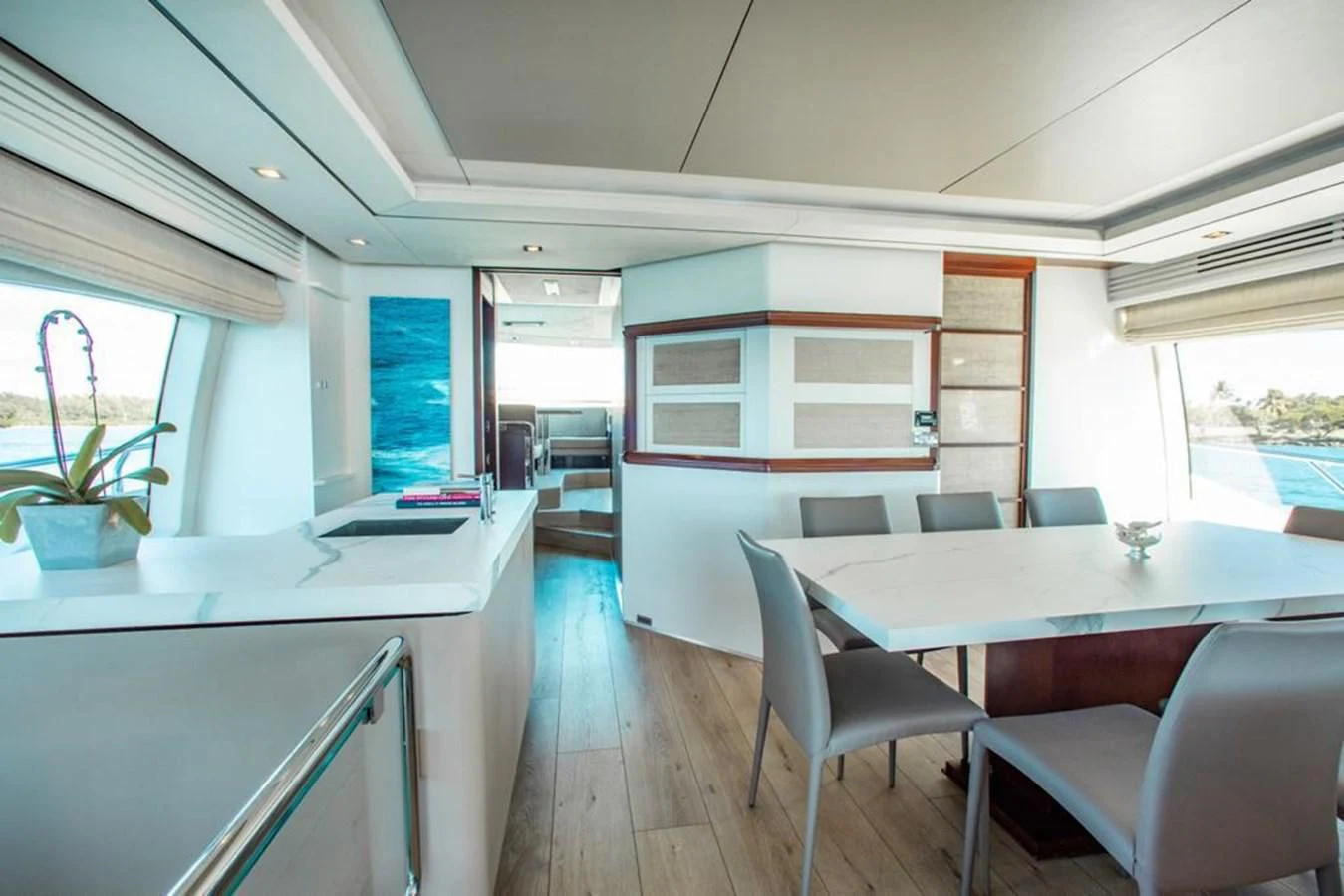 a room with a table chairs and a window aboard BT2 Yacht for Sale