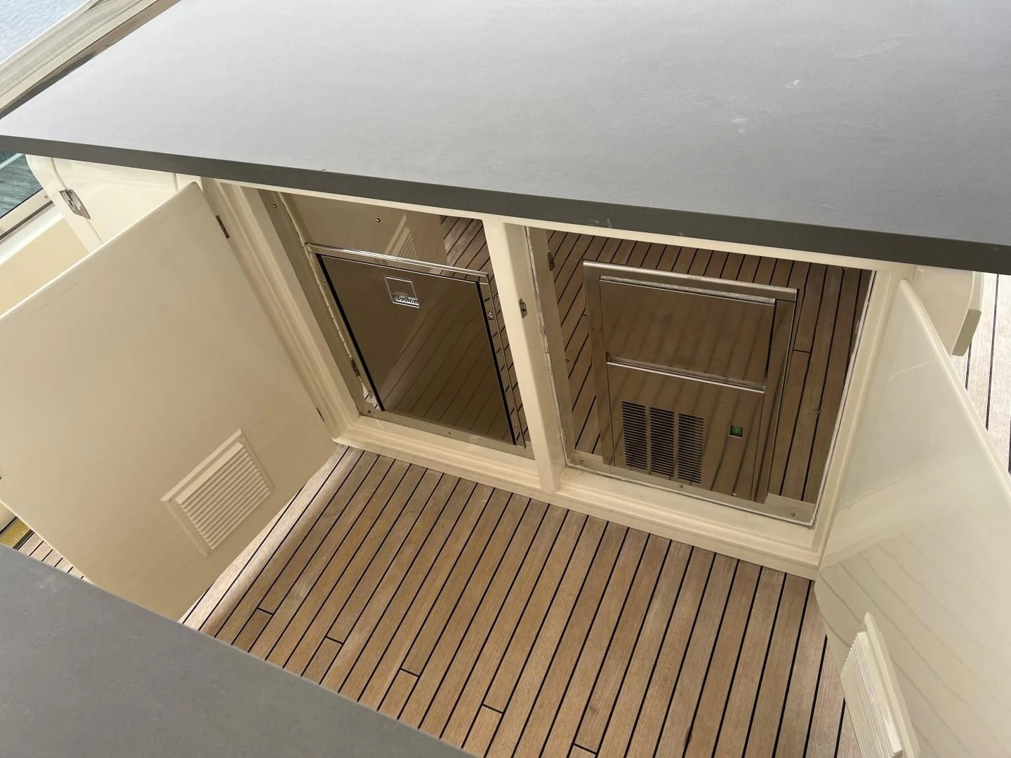 a room with a wood floor and a window with blinds aboard BT2 Yacht for Sale