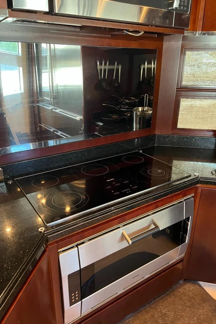 a kitchen with a stove and oven aboard BT2 Yacht for Sale