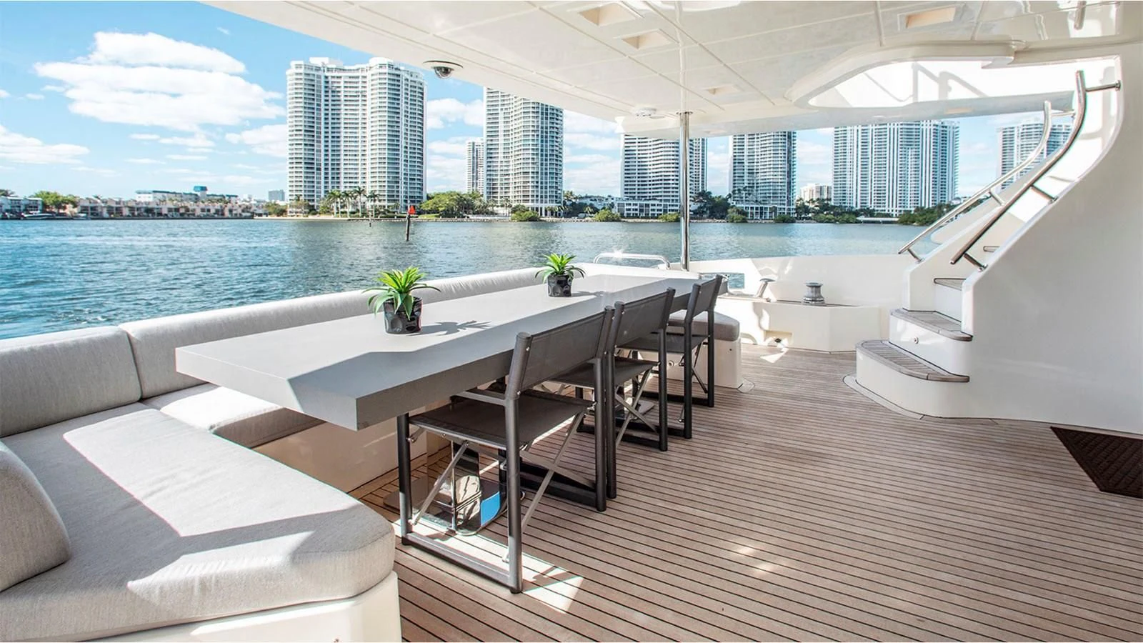 a room with a table and chairs aboard BT2 Yacht for Sale