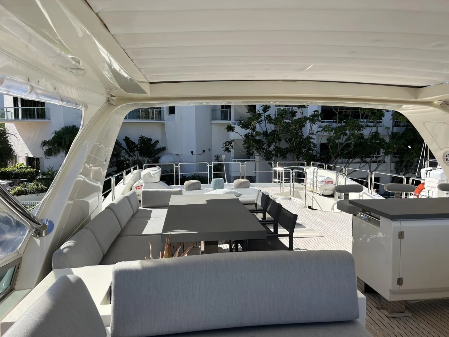 a room with a couch and a table and chairs aboard BT2 Yacht for Sale