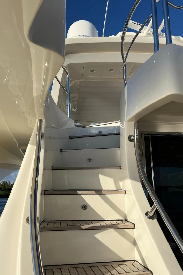 a white staircase with a metal railing aboard BT2 Yacht for Sale