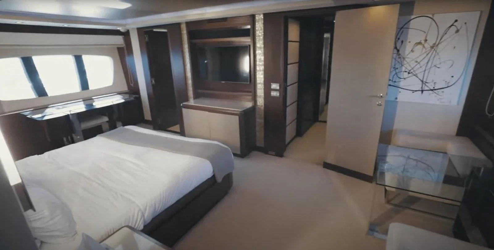 a room with a bed and a desk aboard BT2 Yacht for Sale