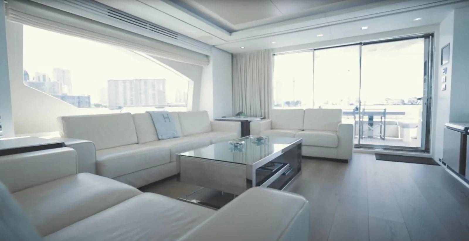 a living room with a large window aboard BT2 Yacht for Sale