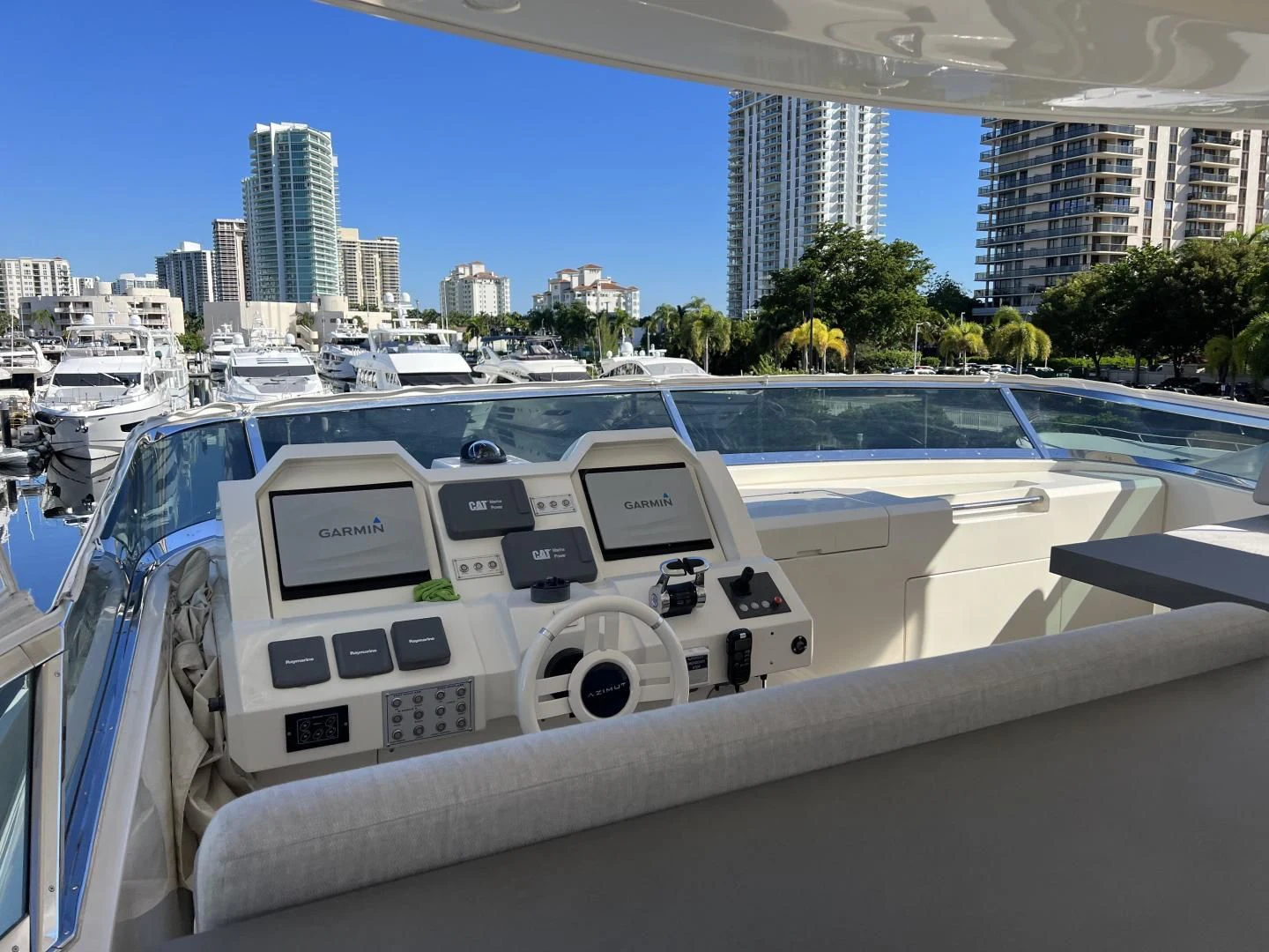 a white yacht in a harbor aboard BT2 Yacht for Sale