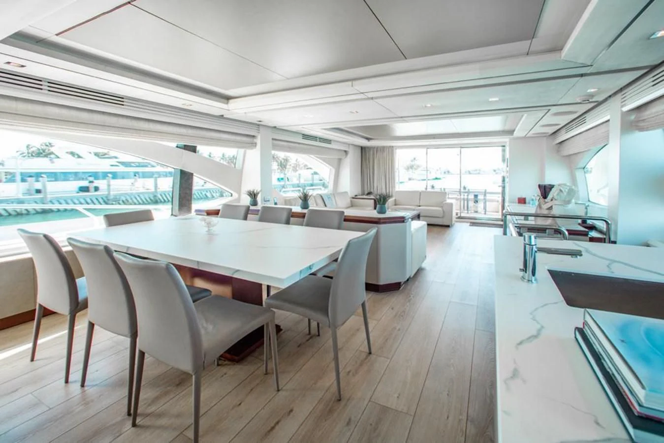 a room with a table and chairs aboard BT2 Yacht for Sale