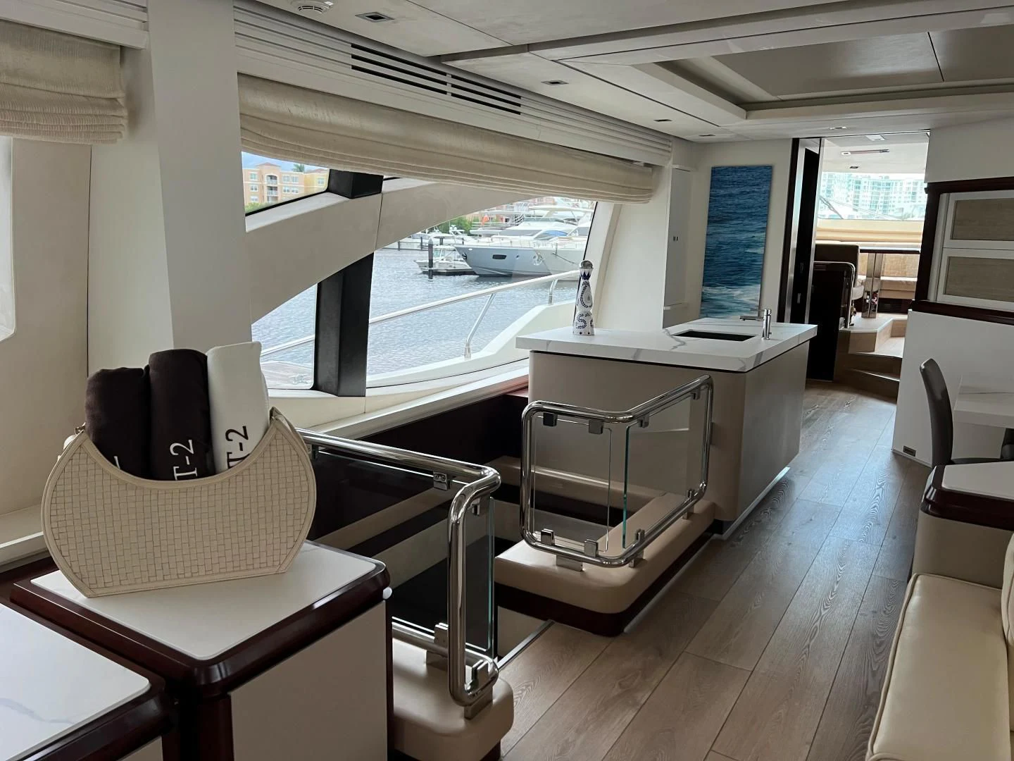 a room with a large window and a table with chairs and a large window aboard BT2 Yacht for Sale