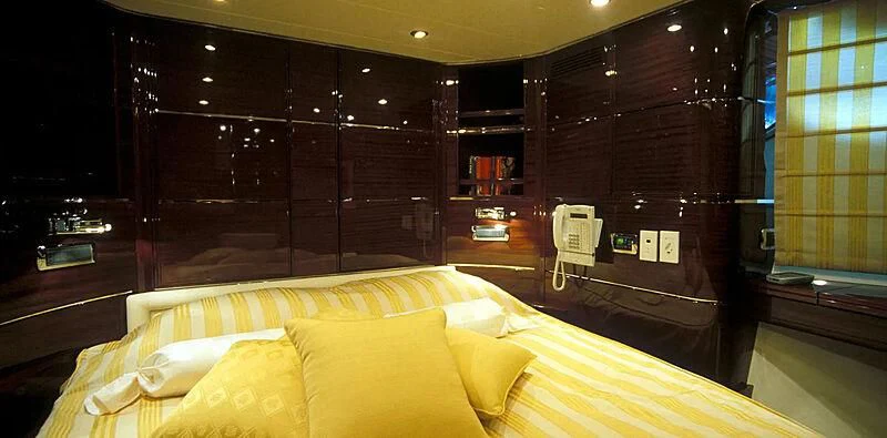 a room with a bed and a window aboard CONTESSINA Yacht for Sale