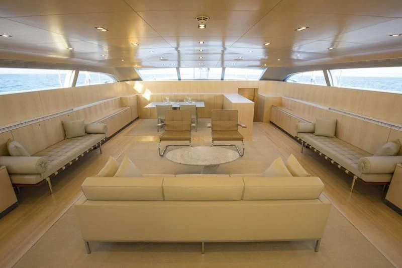 a room with couches and a table aboard UNFURLED Yacht for Sale