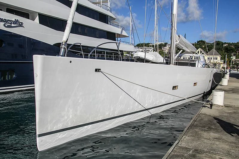 a white boat docked aboard UNFURLED Yacht for Sale