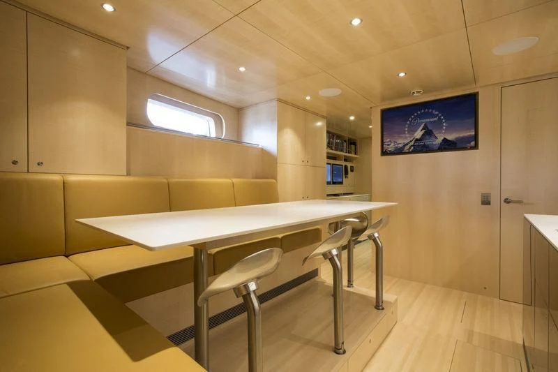 a room with a table and chairs aboard UNFURLED Yacht for Sale