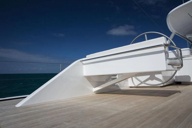 a white boat on a wooden surface aboard UNFURLED Yacht for Sale